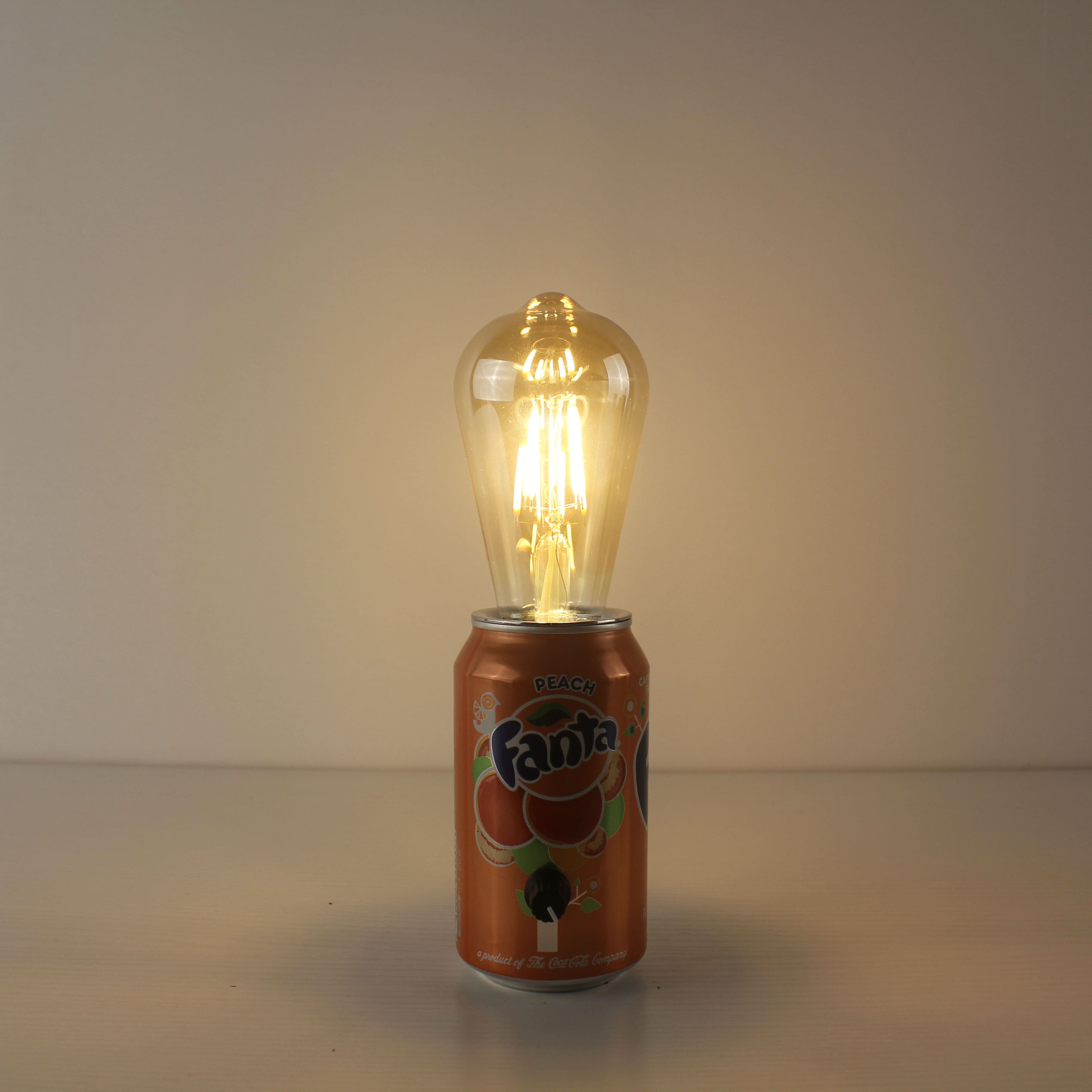 upcycled fanta soda pop can rechargeable eco-friendly table lamp